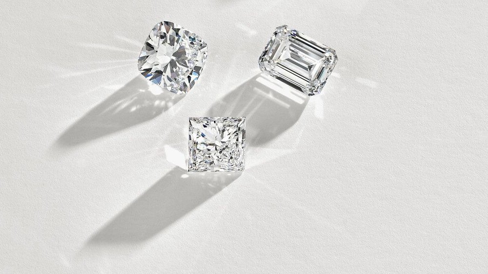 Three sparkling diamonds on surface.